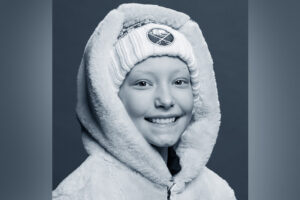 Sophia, who has a rare type of liver cancer, wears a hat and winter coat