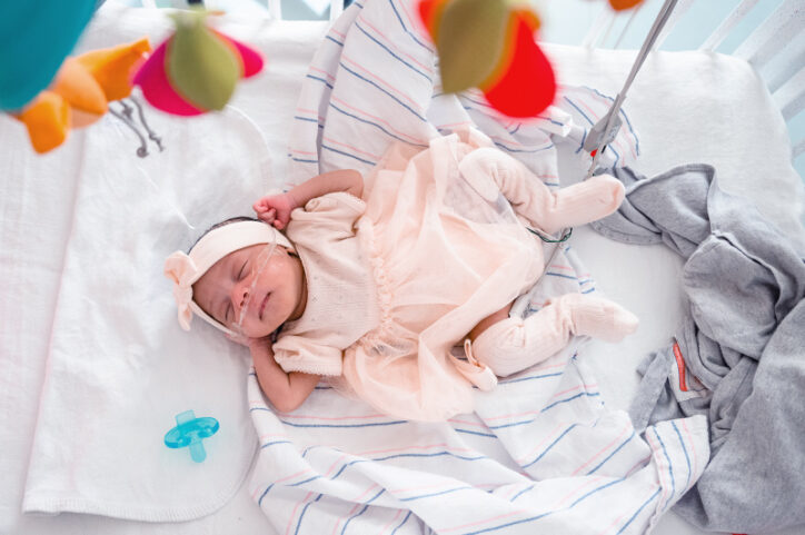 Denver sleeps in her NICU crib after a successful fetal intervention for VOGM