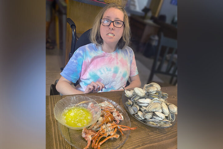 sage eats crab legs and clams at a restaurant
