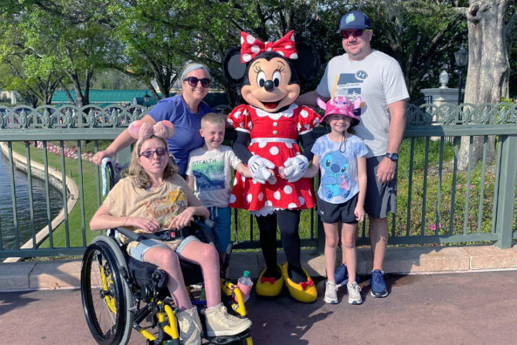 Sage with her parents and siblings at Disney World