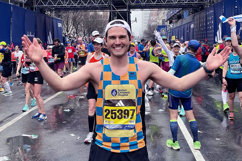 Corey, who had ACL surgery, at the Boston Marathon finish line