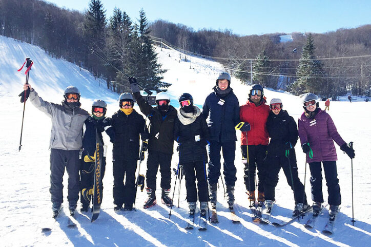 A group of skiers at the bottom of a trail before Corey tore his ACL. 