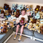 Josie, who has to wear a scoliosis brace, surrounded by stuffed animals.
