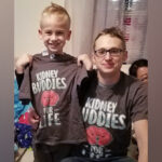 Nolan and his uncle Jon wear matching shirts that read 