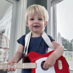 Nolan, who underwent surgery for a severe CDH, plays his toy guitar