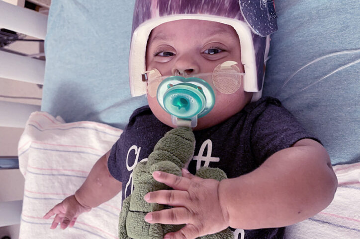 Jayden holds his alligator binkie, given to him during his stay at Boston Children's.
