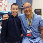 Iker poses with Dr. Richard Lee, who fixed his urinary blockage