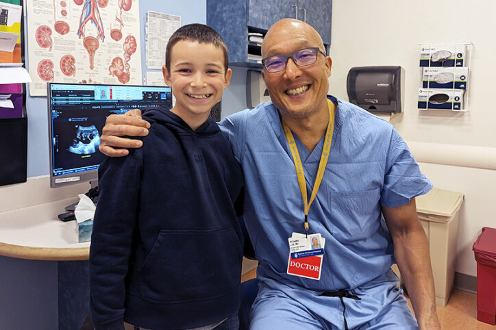 Iker poses with Dr. Richard Lee, who fixed his urinary blockage