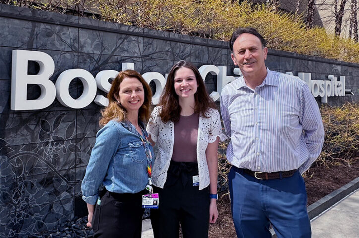 Dr. Nancy Rodig, Emily Toal, and Dr. David Briscoe pose in front of Boston Children's Hospital sign