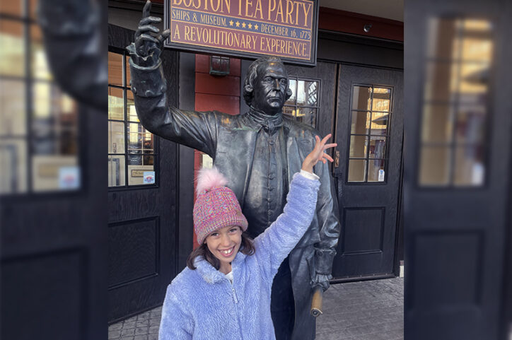 Jenny stands in front of the Boston Tea Party museum