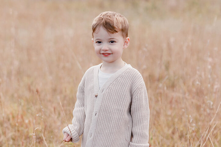 Hudson standing in a field