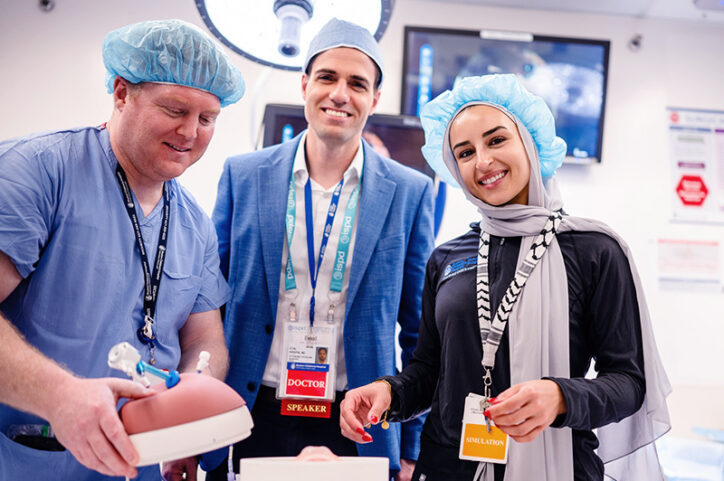 IDS senior development engineer Michael Silver, MFCC fetal surgeon Eyal Krispin, MD, and IDS simulation production engineer Saja Traoui pose with the NTD model.