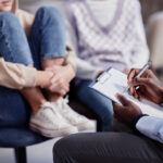 a young woman talking with a health care provider