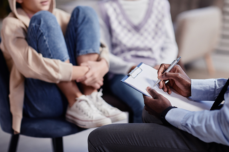 a young woman talking with a health care provider