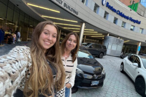 Kiersten and her mom, Deirdre, take a selfie outside the main entrance of Boston Children's.