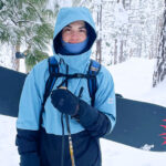 Griffin, who dislocated both kneecaps at different times, in the backwoods of a ski trail with a snowboard.