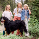 Clara and her sisters, Poppy and Eleanor, go hiking with a family dog.