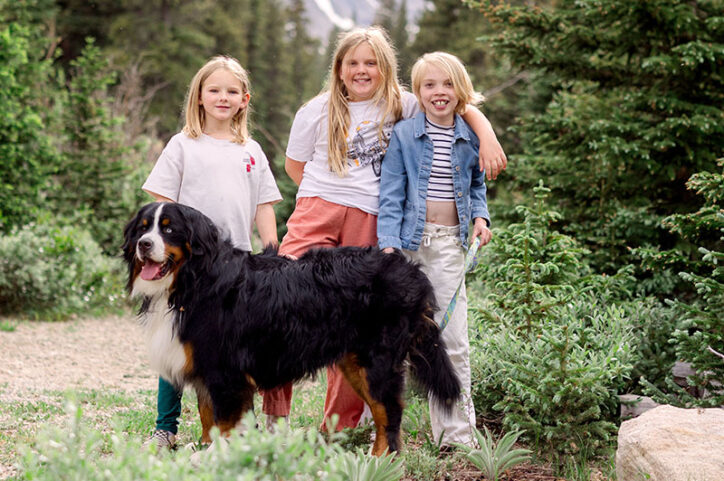 Clara and her sisters, Poppy and Eleanor, go hiking with a family dog.