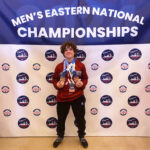 Kaleb shows off his medals at the Men's Eastern National Championships.