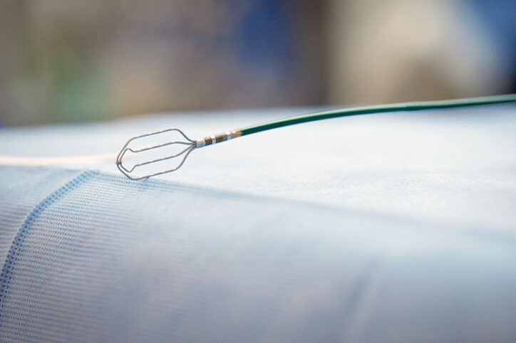 A grid-mapping catheter rests on an operating room table before surgery.