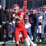 a teen boy playing football